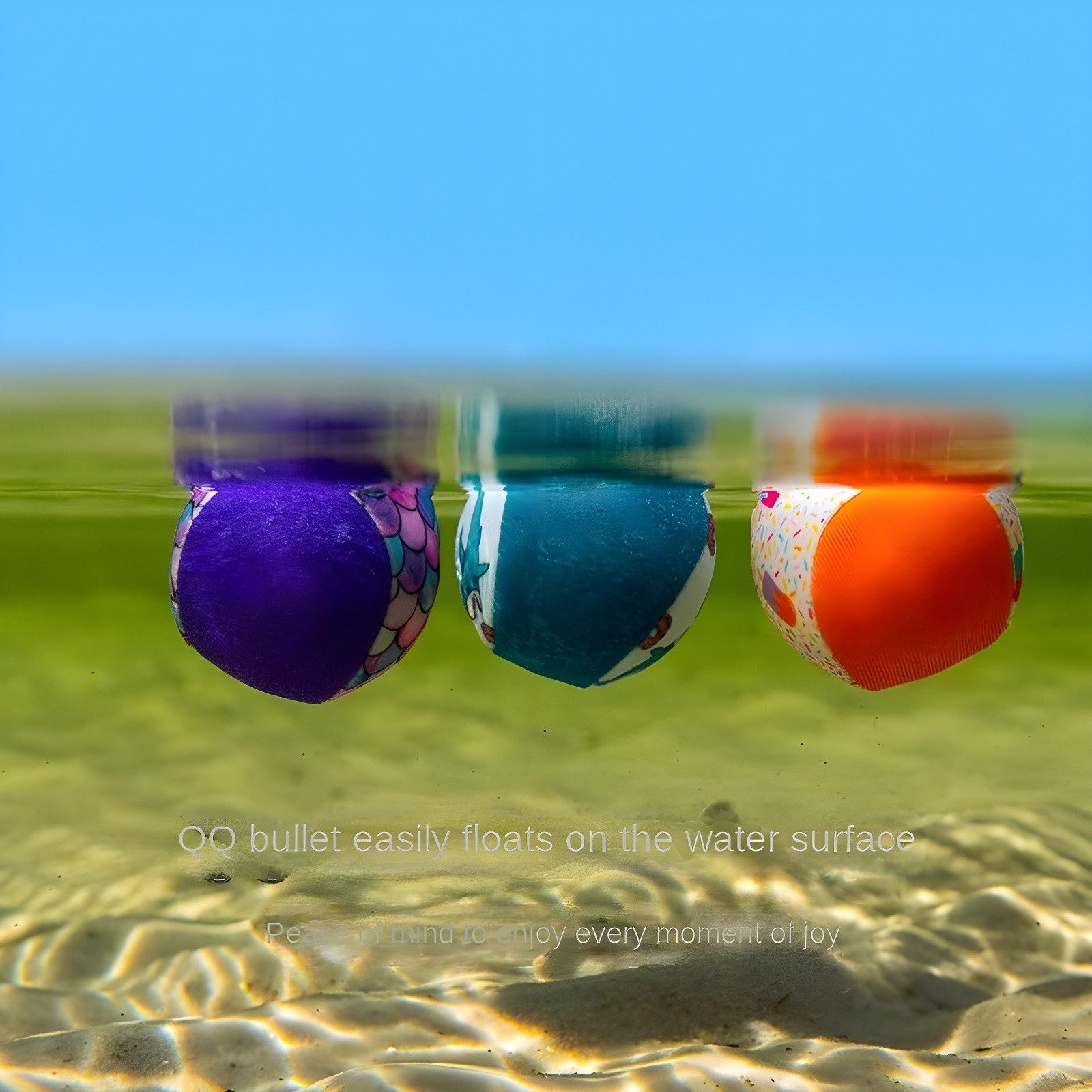Close-up of three colorful water bounce balls floating on water surface