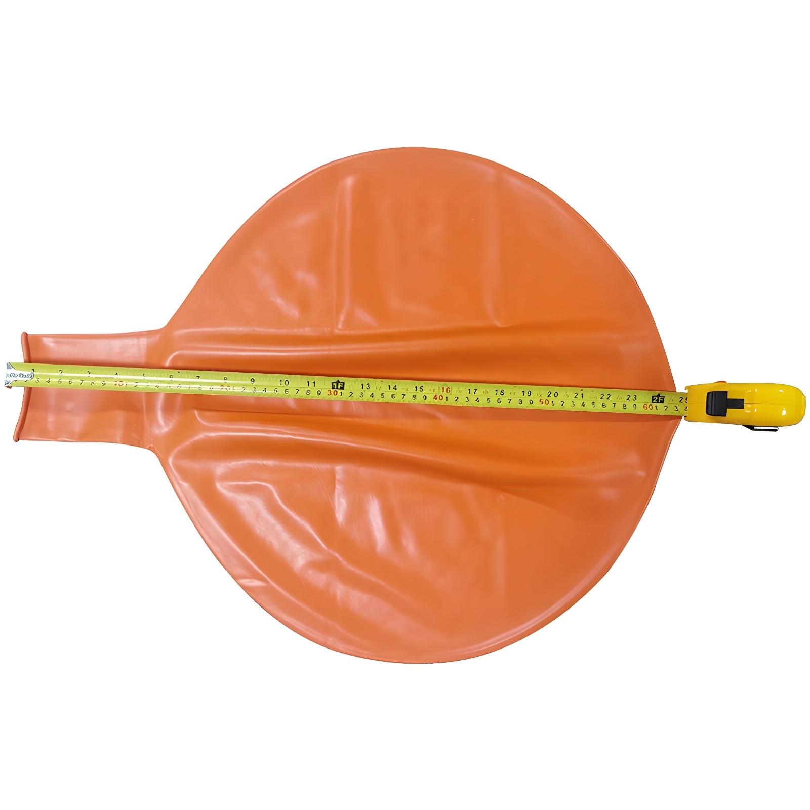 Uninflated orange balloon with tape measure showing dimensions