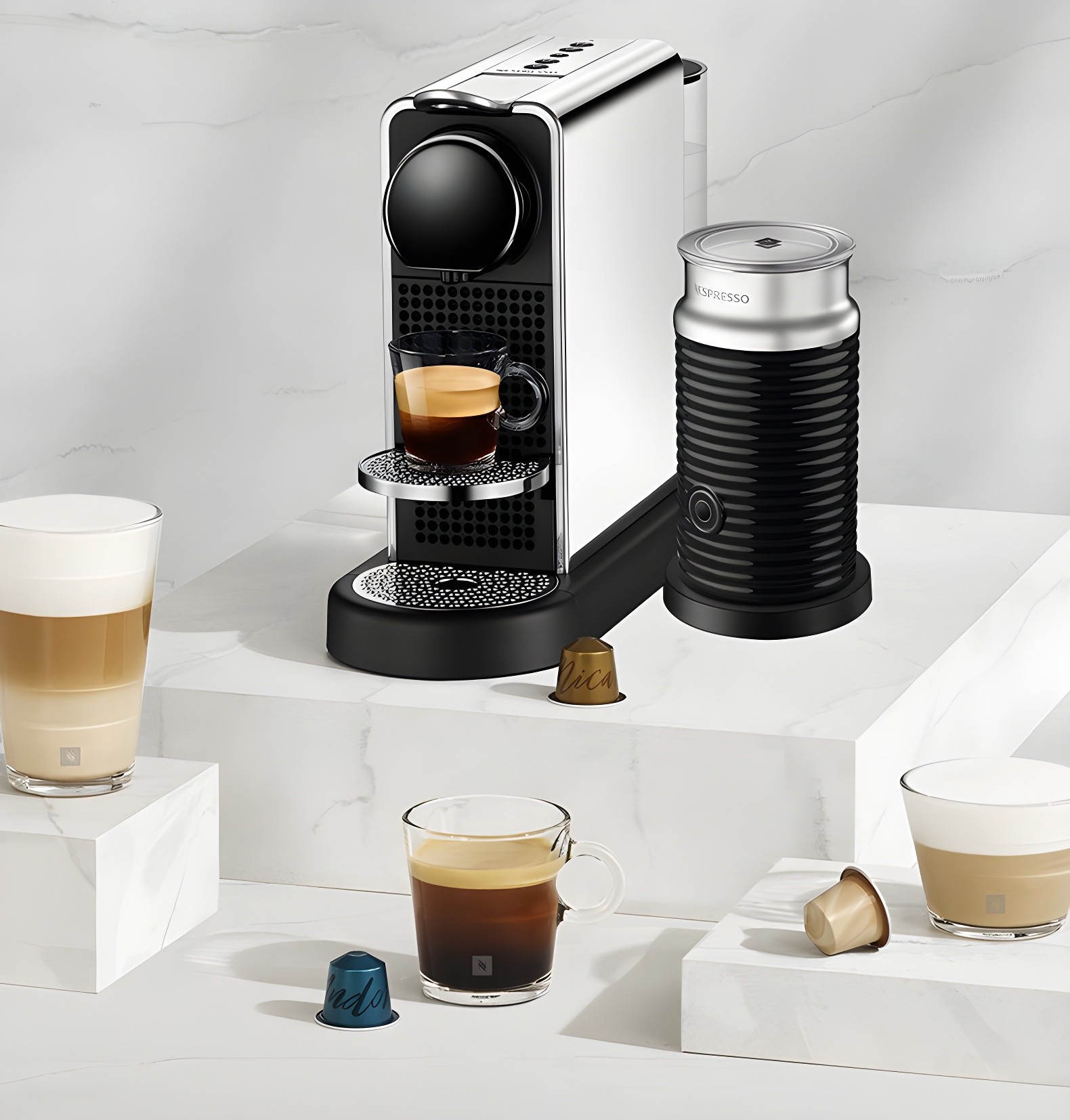 Nespresso Citiz Platinum on white marble with milk frother and capsules