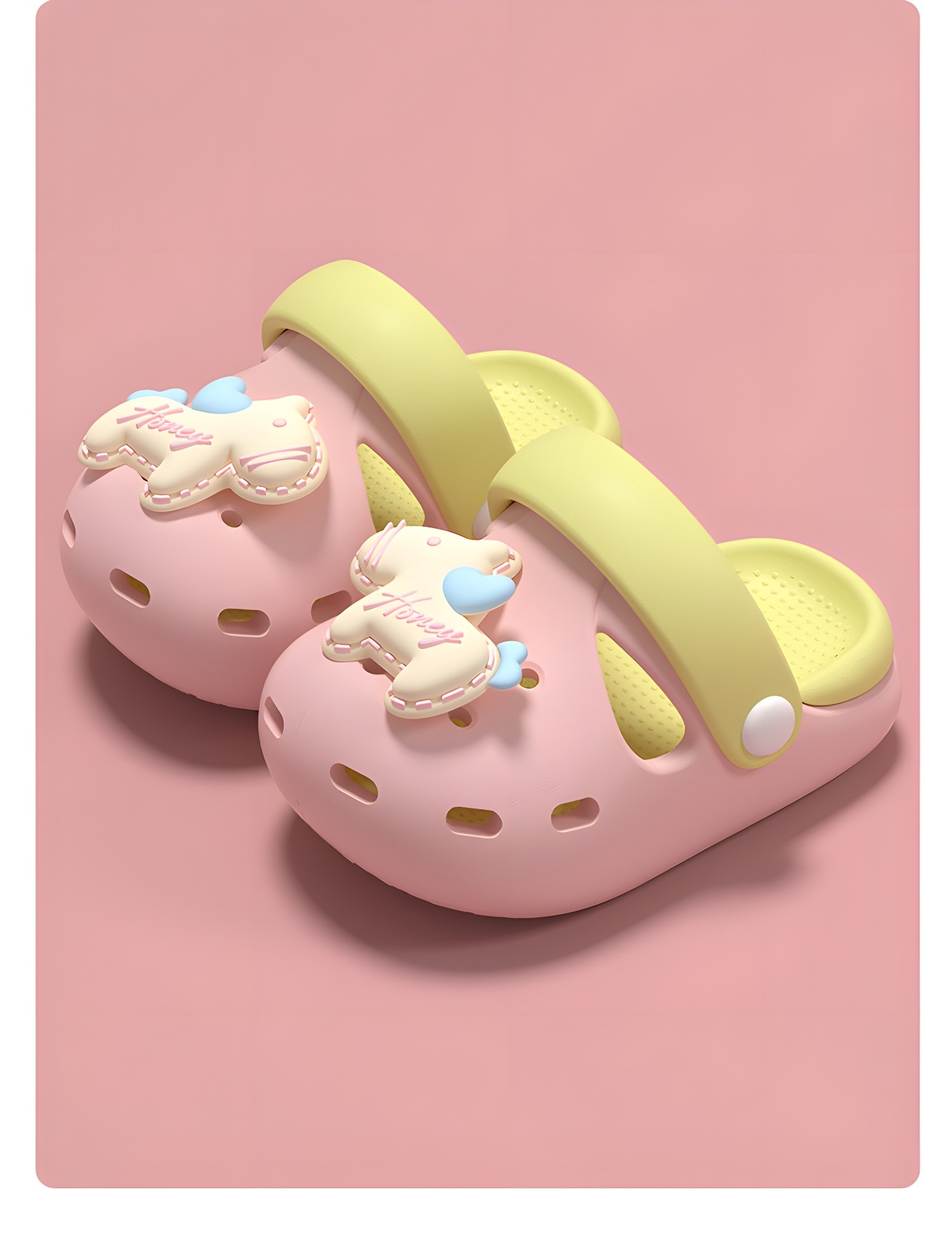 White Toddler Clogs with Pink Accents Held by Hands