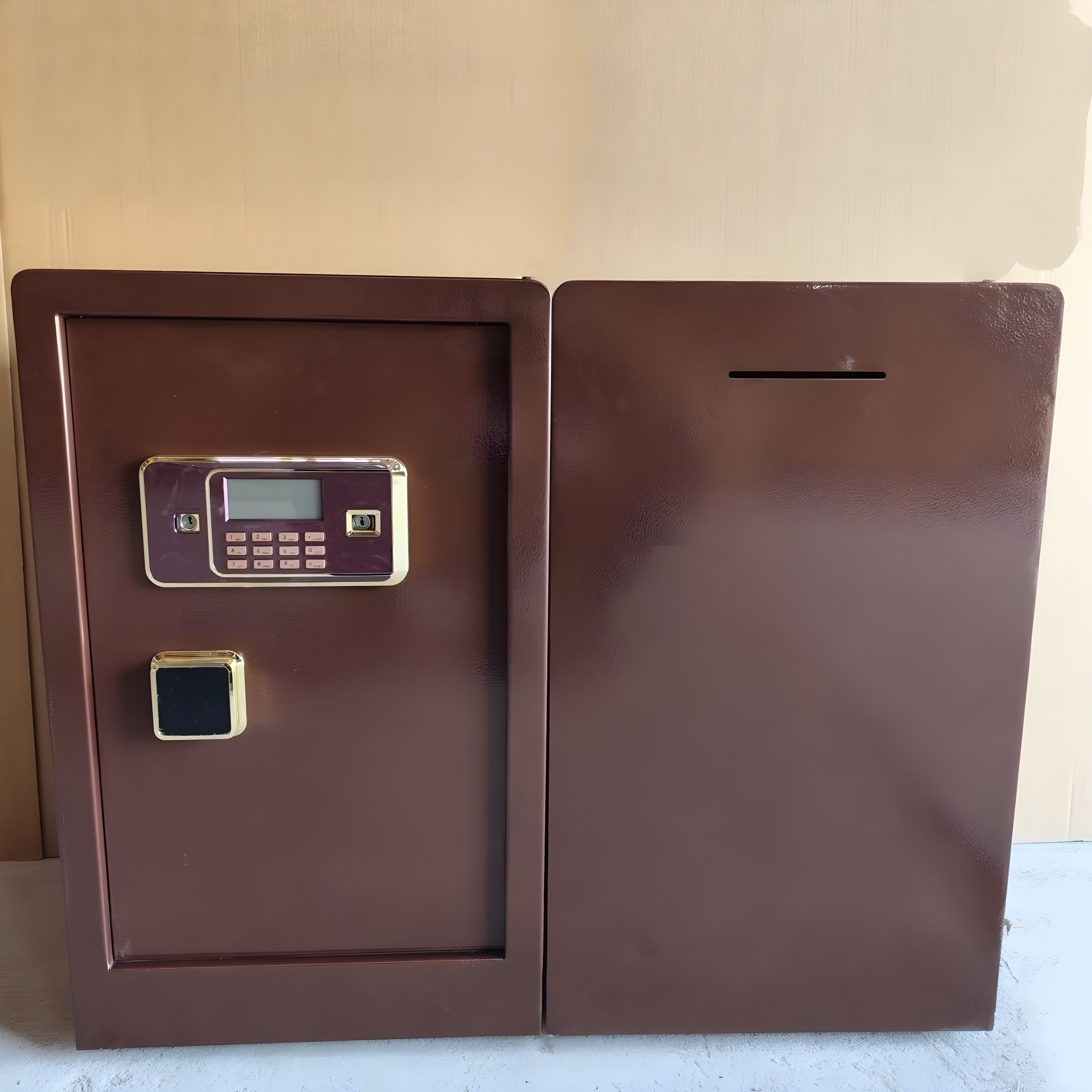 Two safes side-by-side: left with keypad and fingerprint reader, right with deposit slot on top