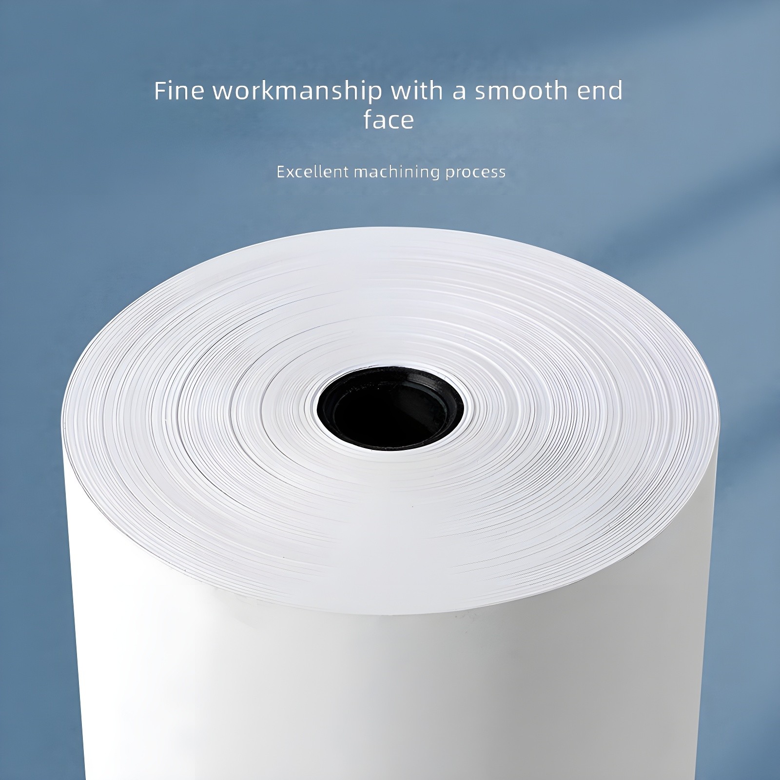Fine workmanship with a smooth end face: Close-up top view of a thermal paper roll on soft blue background, emphasizing precision winding and clean edge