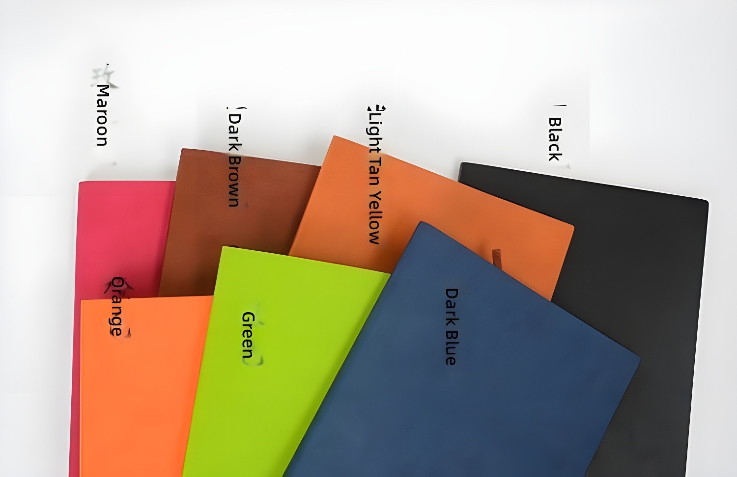 Labeled Chronicle notebooks showing color names: Maroon, Dark Brown, Light Tan Yellow, Black, Orange, Green, Dark Blue