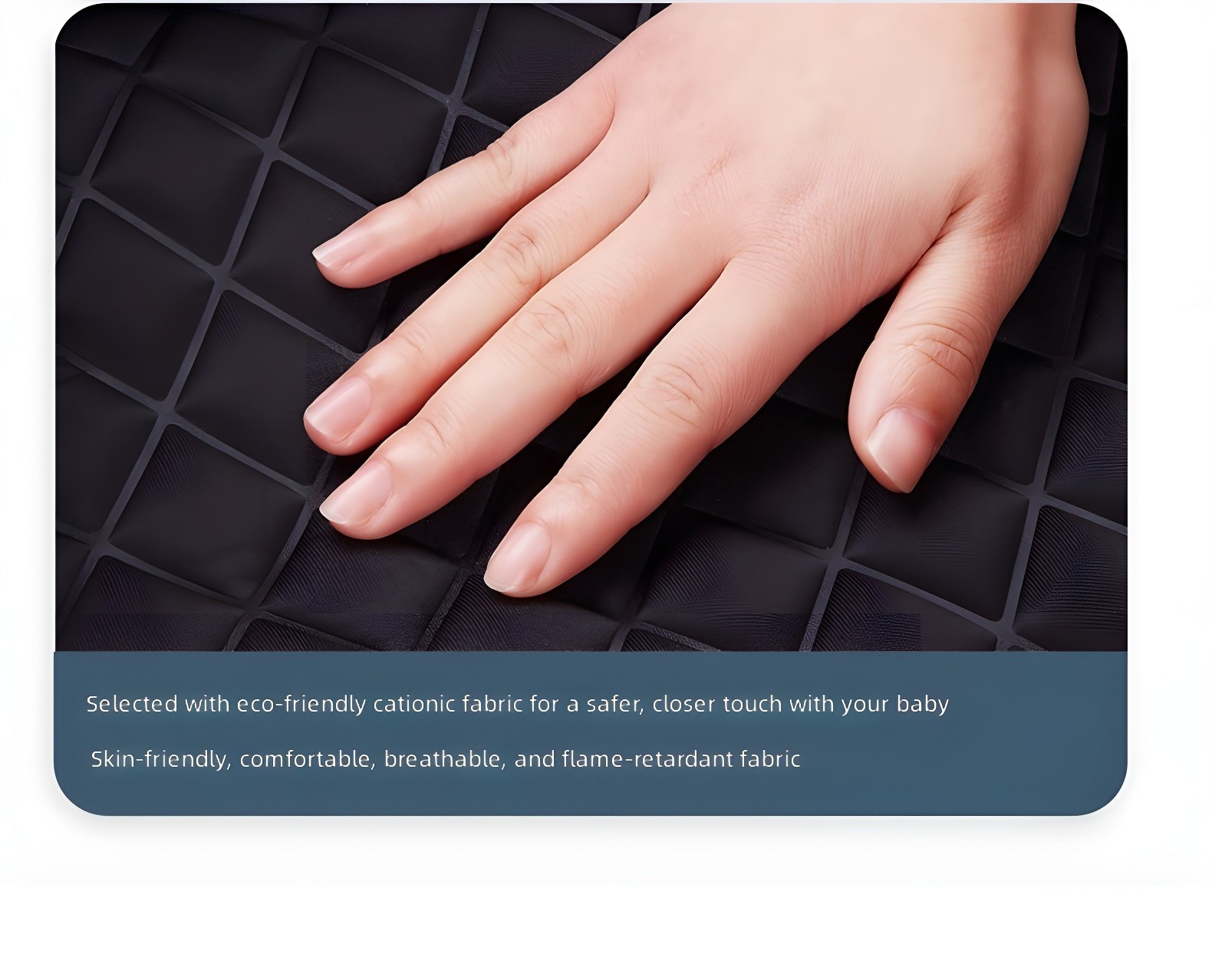 Close-up of hand resting on quilted black fabric surface, highlighting texture and softness