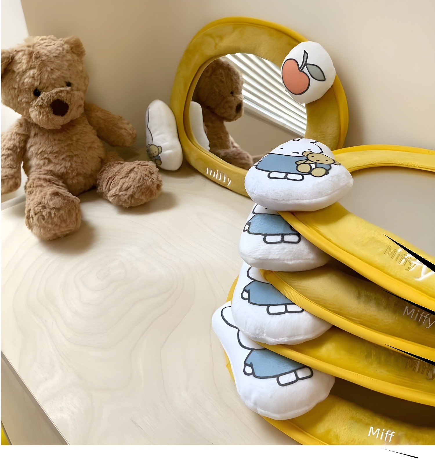 Color photo of yellow Miffy Baby Mirror variant with teddy bear and stacked mirrors