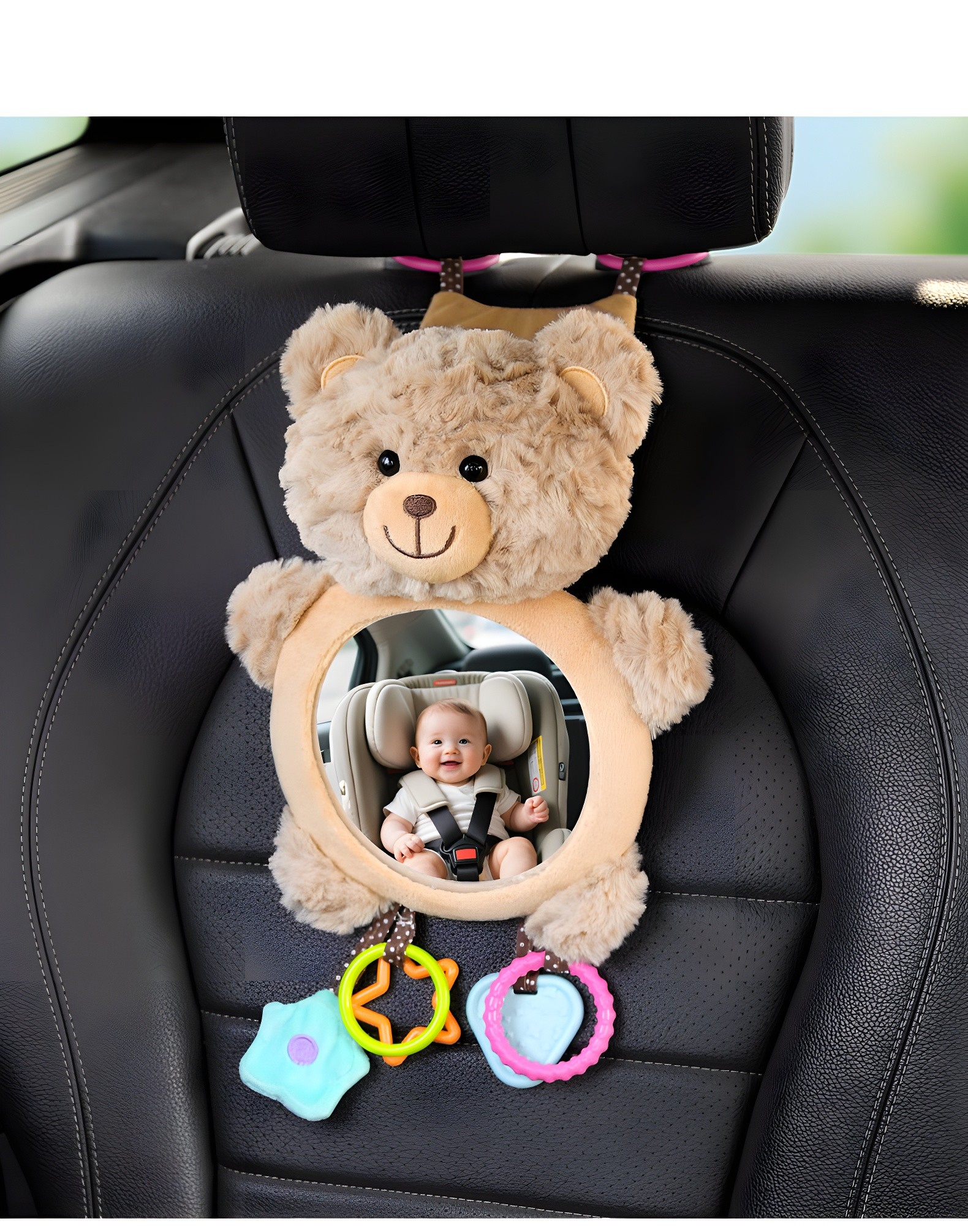 Close-up of beige teddy bear car mirror with smiling baby reflected in mirror