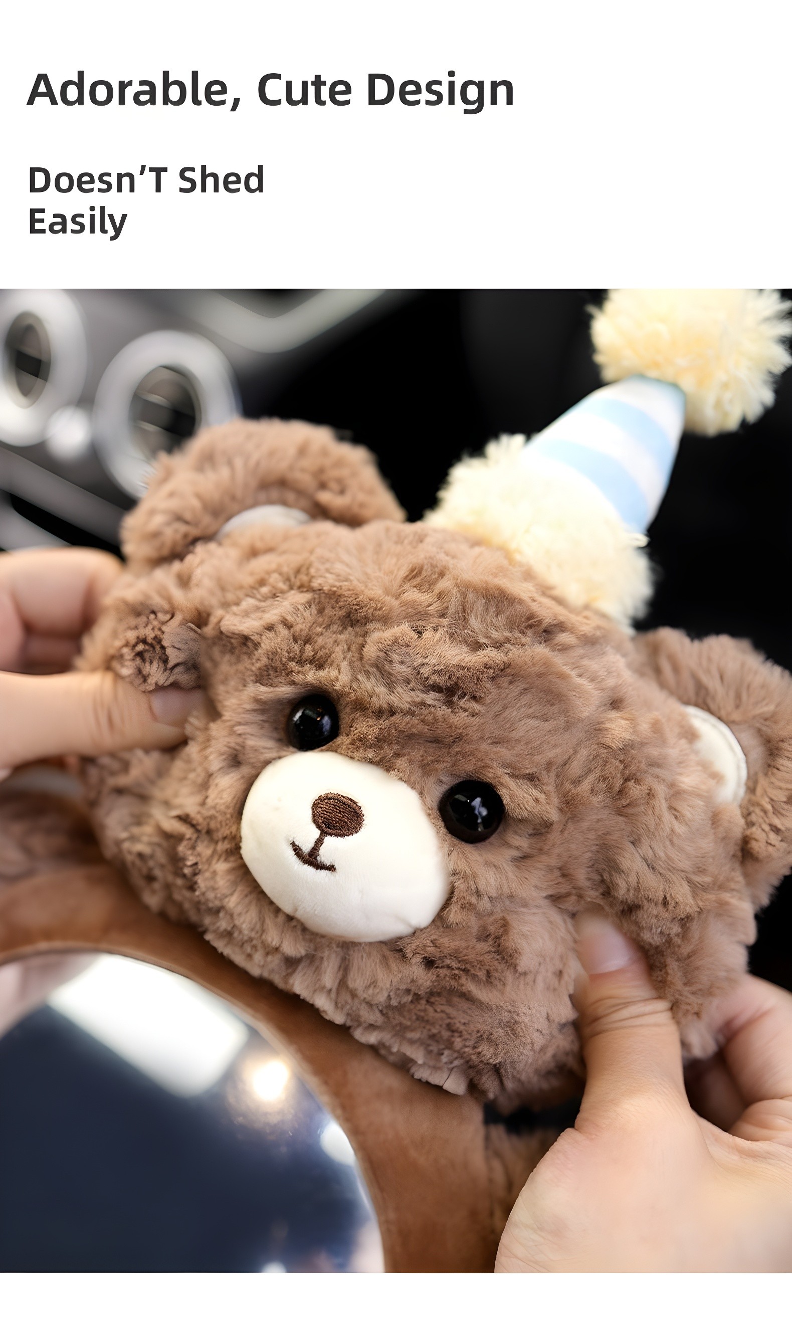 Close-up of hands holding the brown teddy bear mirror, highlighting soft texture and party hat detail